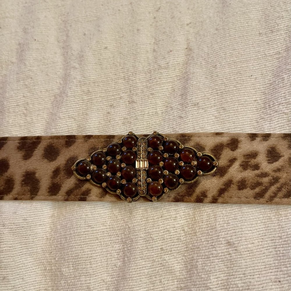 Ladies size 4 cheetah print belt, with jeweled center, pre-owned good condition